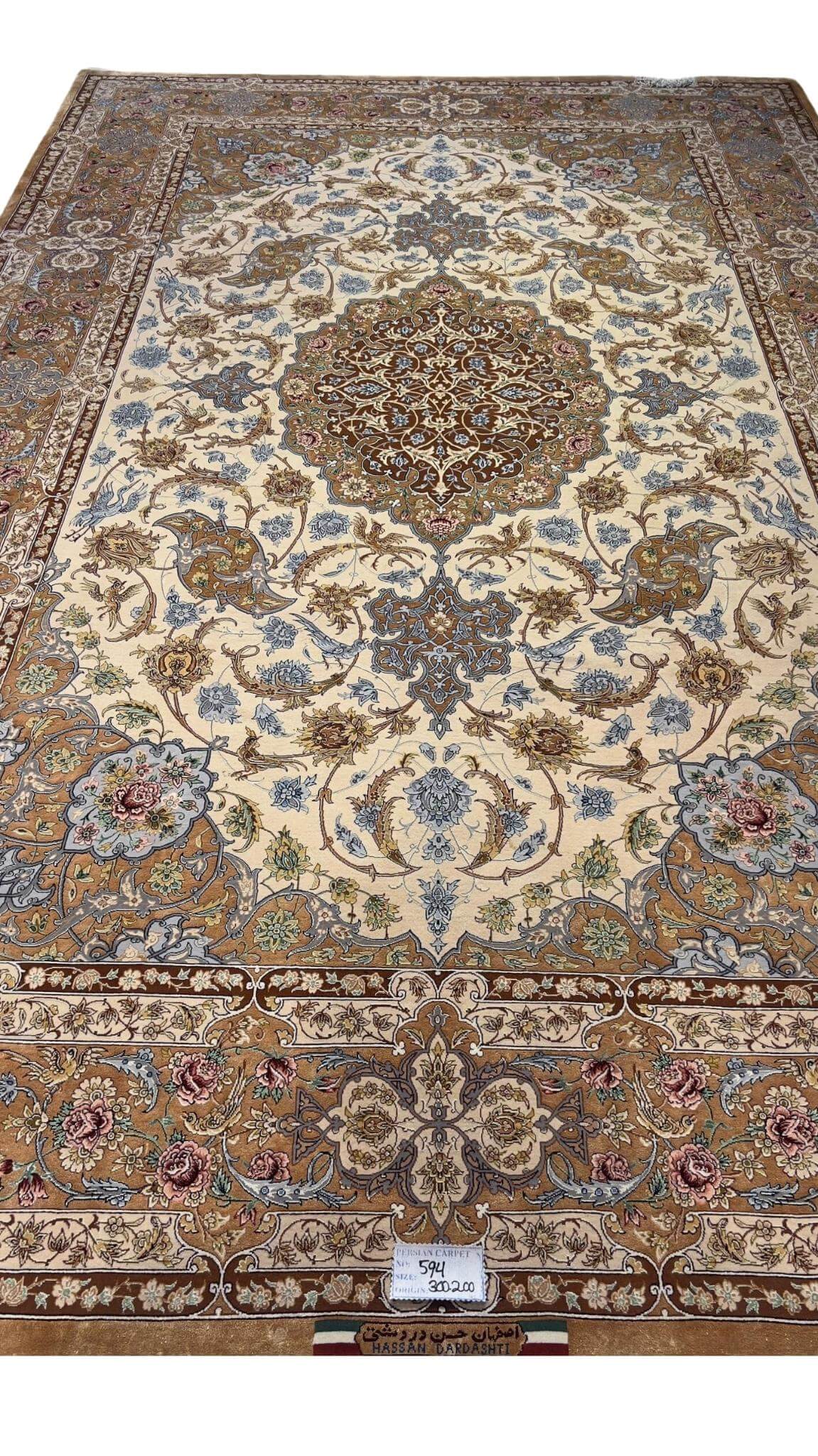 "Detailed Persian Isfahan rug showcasing a silk medallion design and intricate craftsmanship."